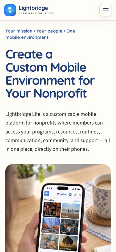 Lightbridge Life’s website on mobile, showing the Lightbridge Charitable Solutions logo, nonprofit introduction, and a person holding a phone.